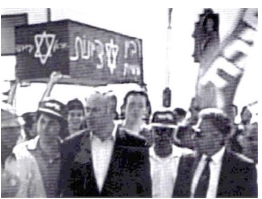 black and white image of bibi with a casket that says rabin on it, before he was murdered