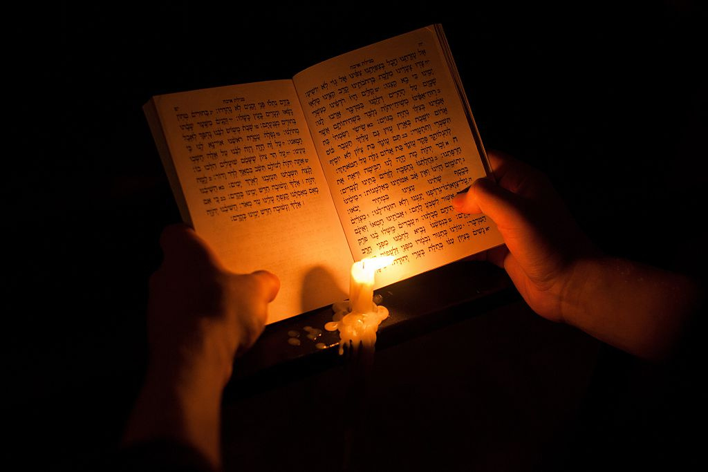 Book of Lamentations in Hebrew, by candlelight