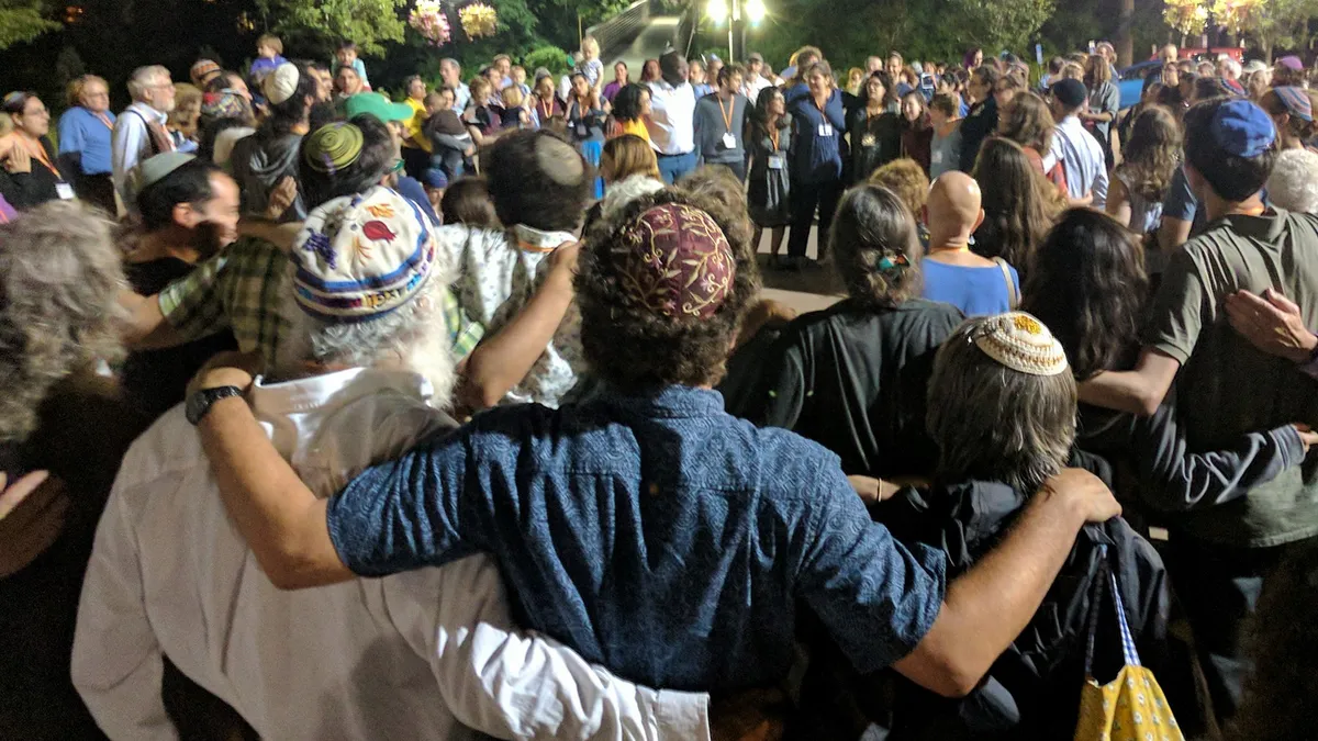 Bunch of Jews with arms around each other