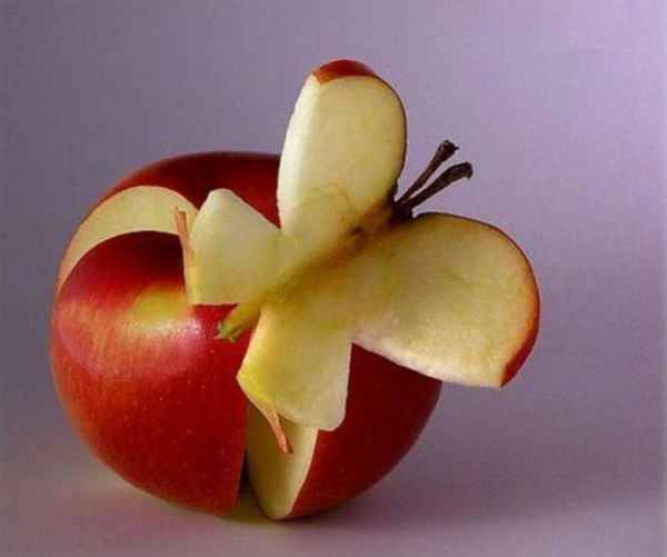 apple carved to look like a butterfly 